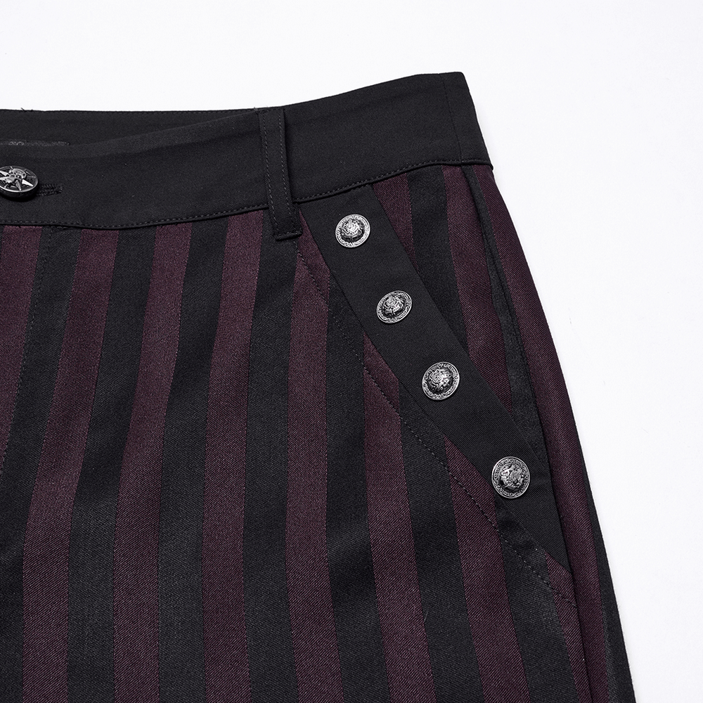 Close-up of striped black and burgundy slim gothic trousers featuring stylish button details.