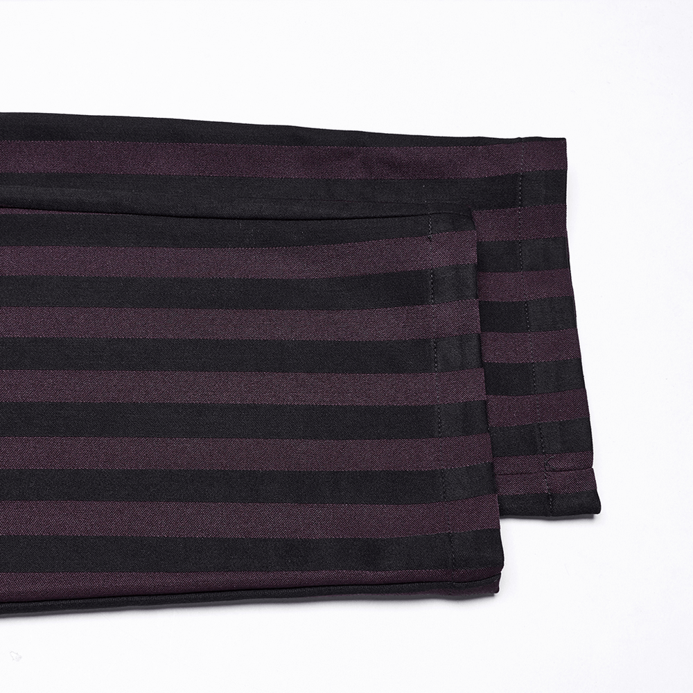 Striped black and burgundy slim gothic trousers folded, showcasing an edgy and stylish design.
