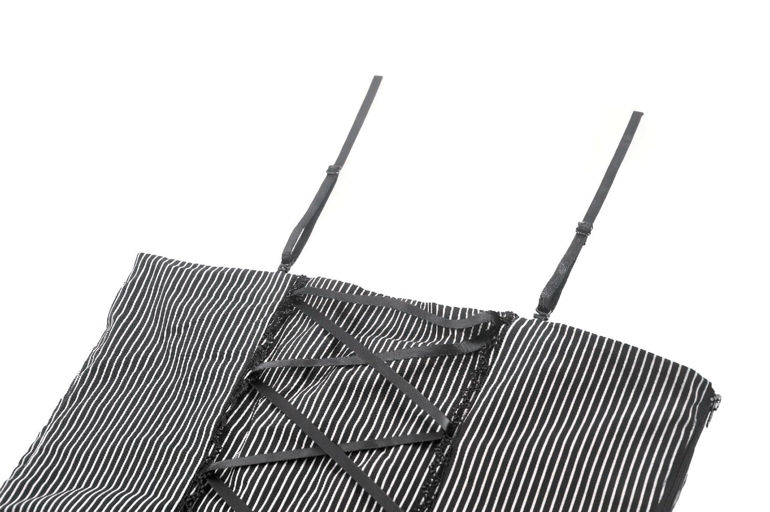 Close-up of a striped black and white top with adjustable straps and lace-up back detailing.