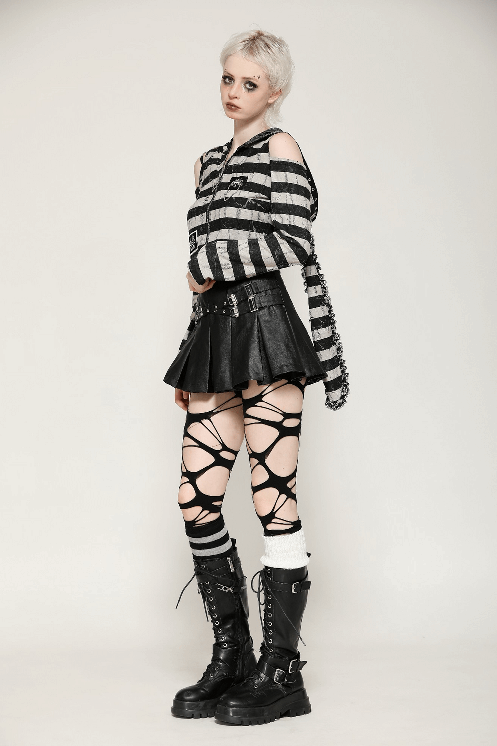 Striped bunny hooded crop top in gothic Lolita style paired with leather mini skirt and edgy boots.