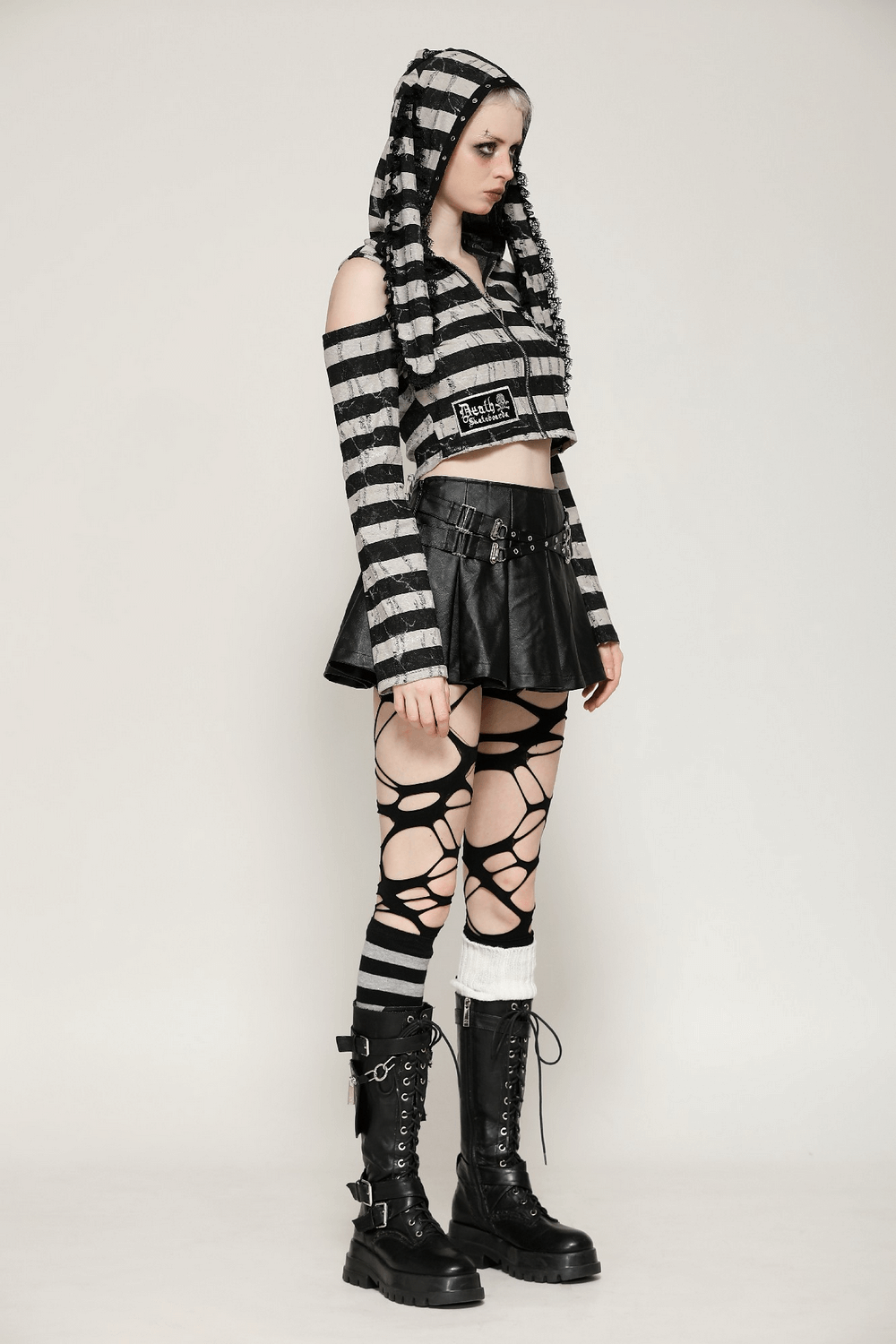 Gothic Lolita striped bunny hooded crop top styled with edgy black skirt and accessories.