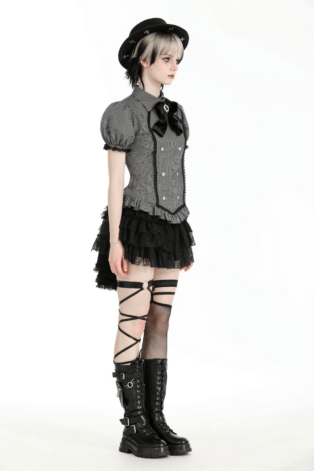 Striped Gothic blouse with bow and lace, paired with ruffled skirt and lace-up boots, exuding Victorian-inspired elegance.