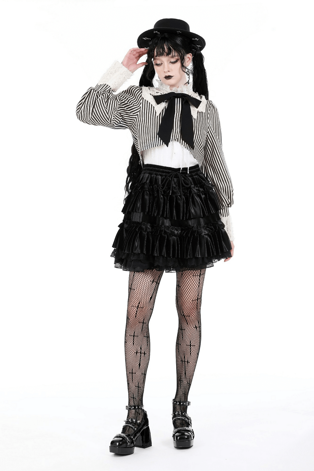Gothic Lolita model wearing a striped puff sleeve crop top, black skirt, and stylish hat, showcasing trendy punk fashion.