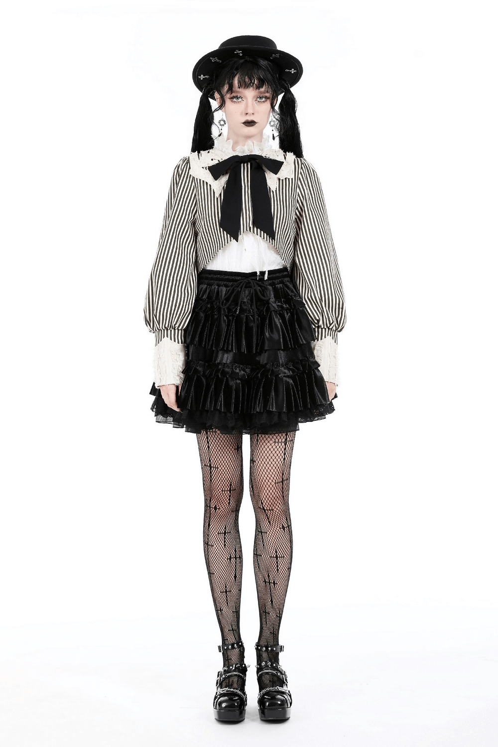 Gothic Lolita crop top with puff sleeves, black and beige stripes, styled with a ruffled skirt and fishnet tights.