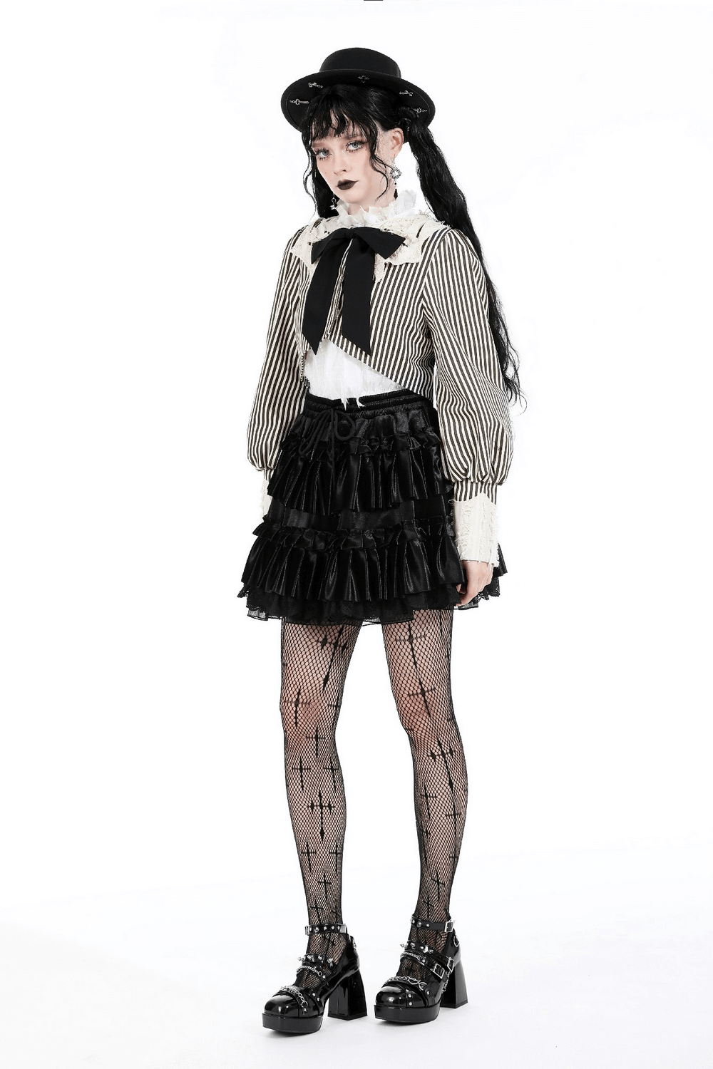 Gothic Lolita fashion: striped crop top, puff sleeves, stylish black skirt, cute bow, and unique accessories.