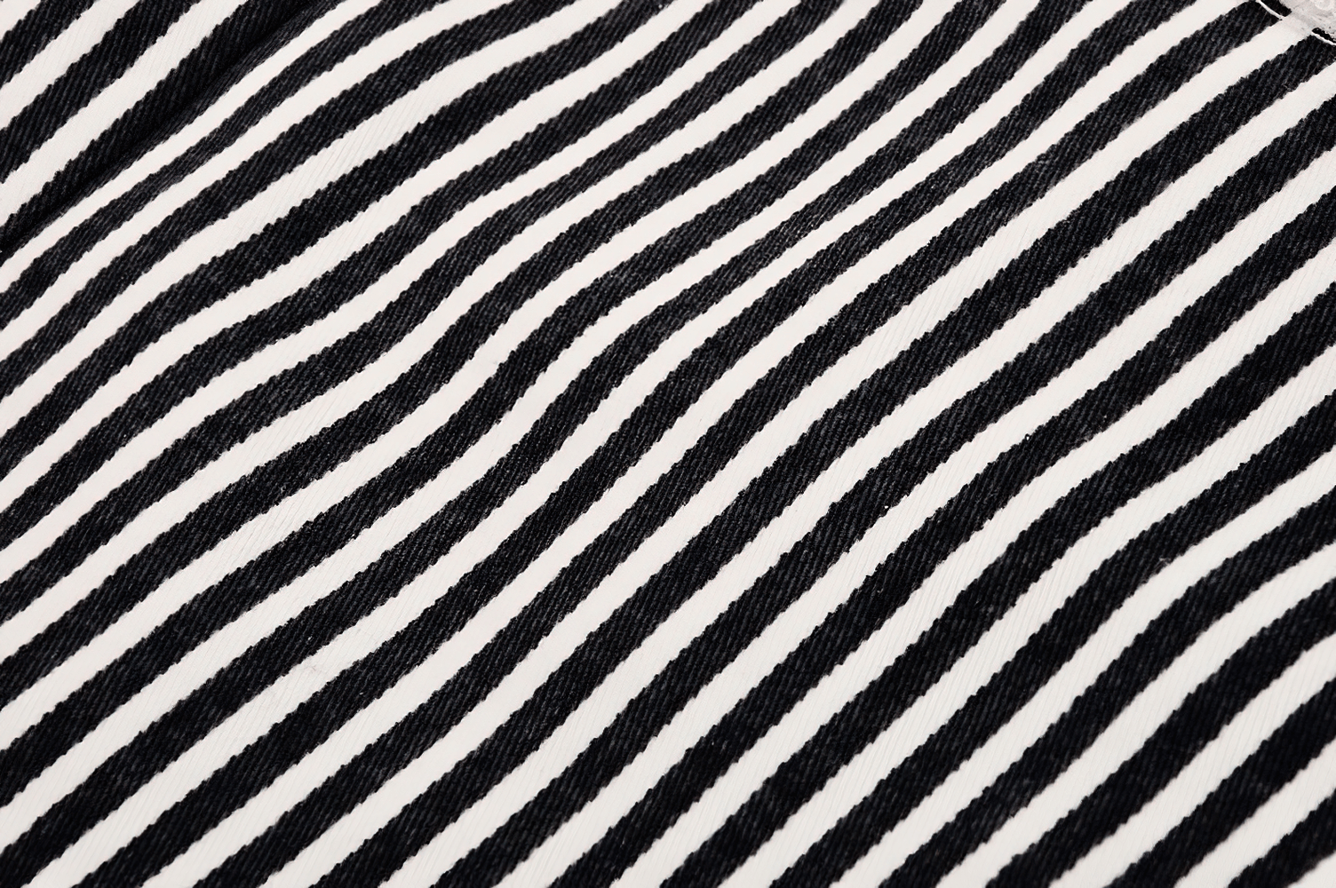 Close-up of black and white striped fabric for a chic Gothic Lolita crop top.
