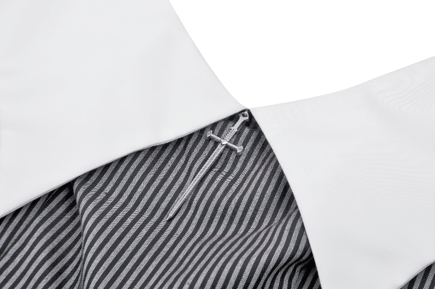 Close-up of the unique white collar and striped fabric of an elegant long-sleeved dress, showcasing chic detail and design.