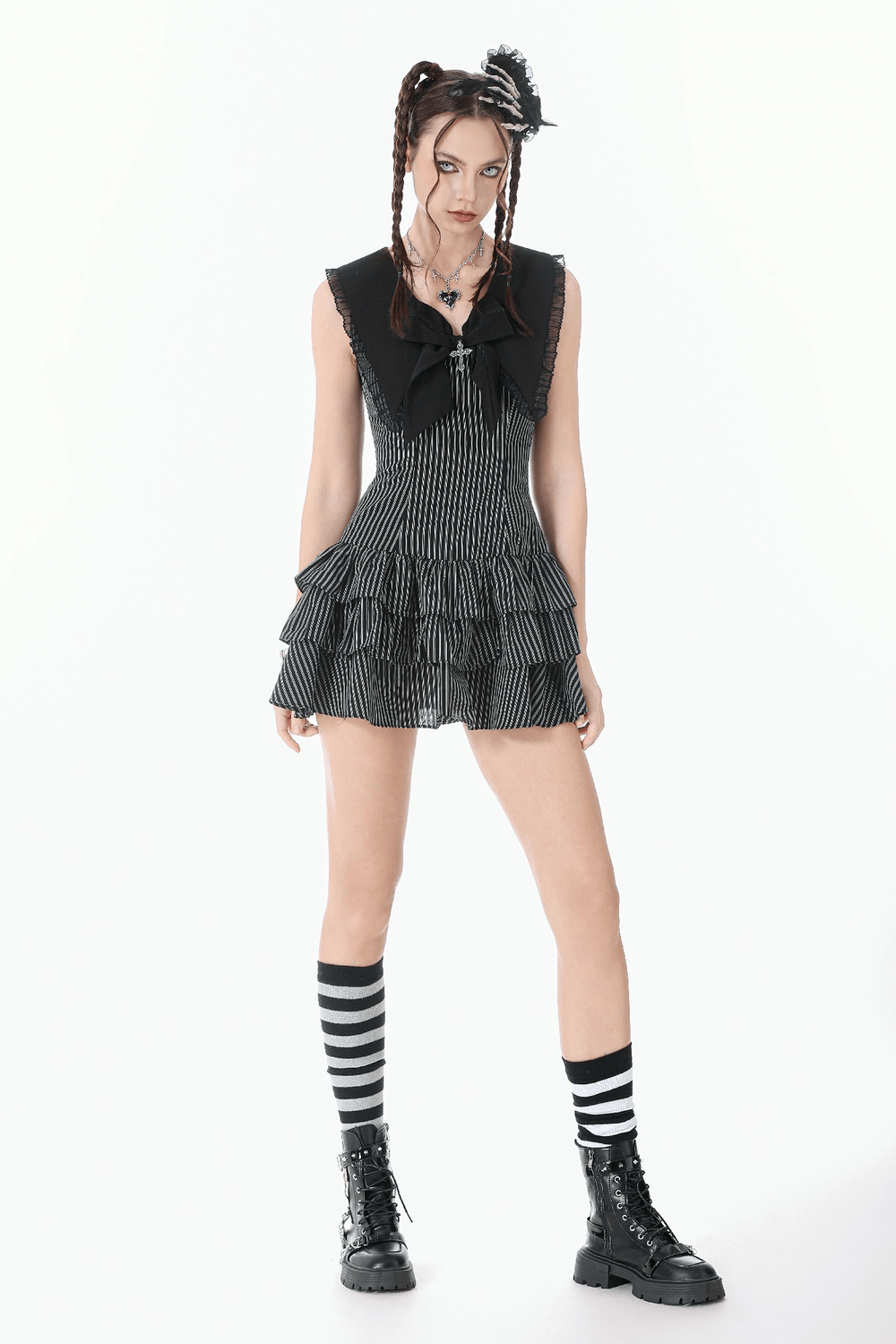 Striped Ruffle Dress with Bow and Lace-Up Back for Women, featuring tiered ruffles and a chic black-and-white design.