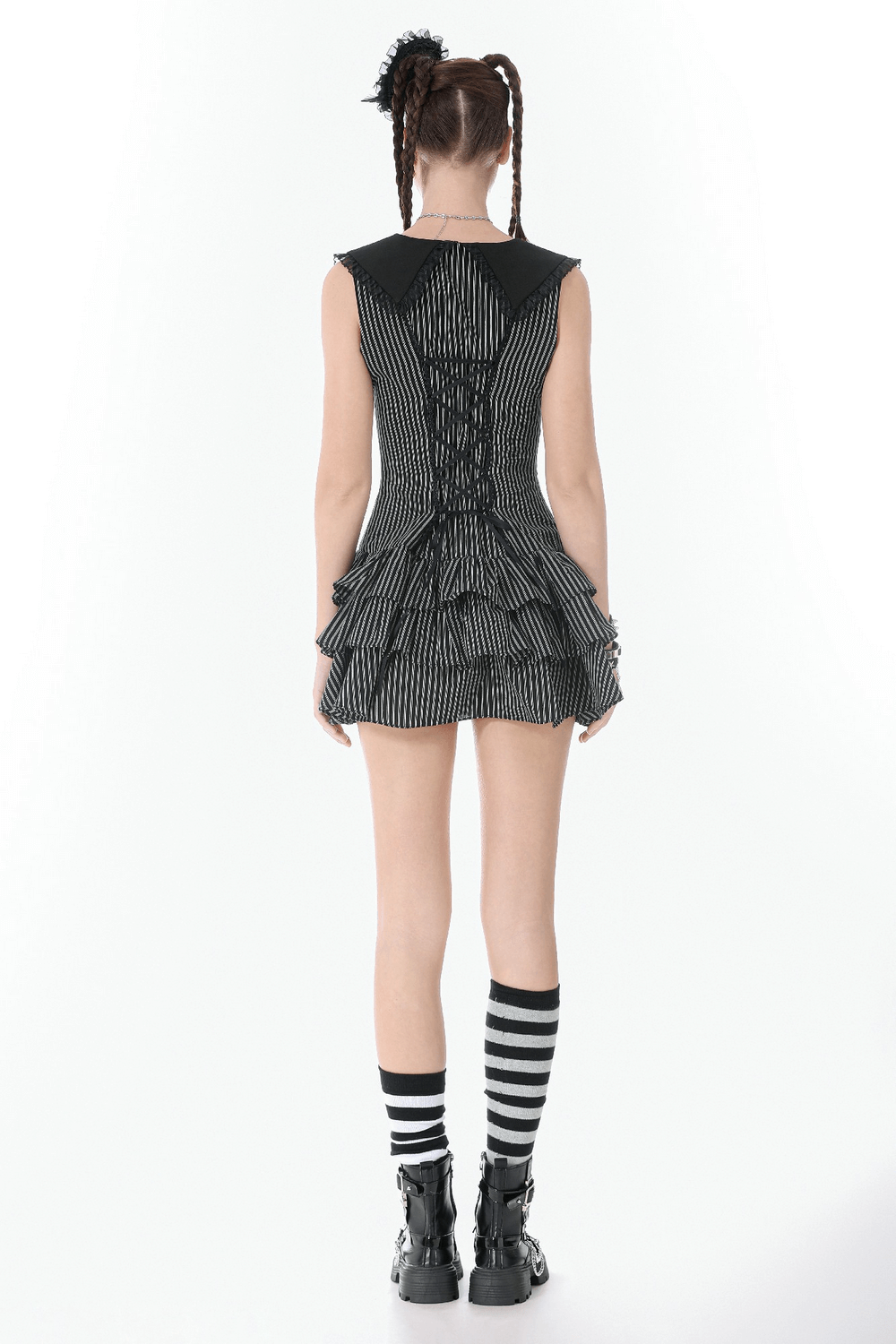 Striped Ruffle Dress with Bow and Lace-Up Back for Women, showcasing the back design and tiered ruffles in black and white.