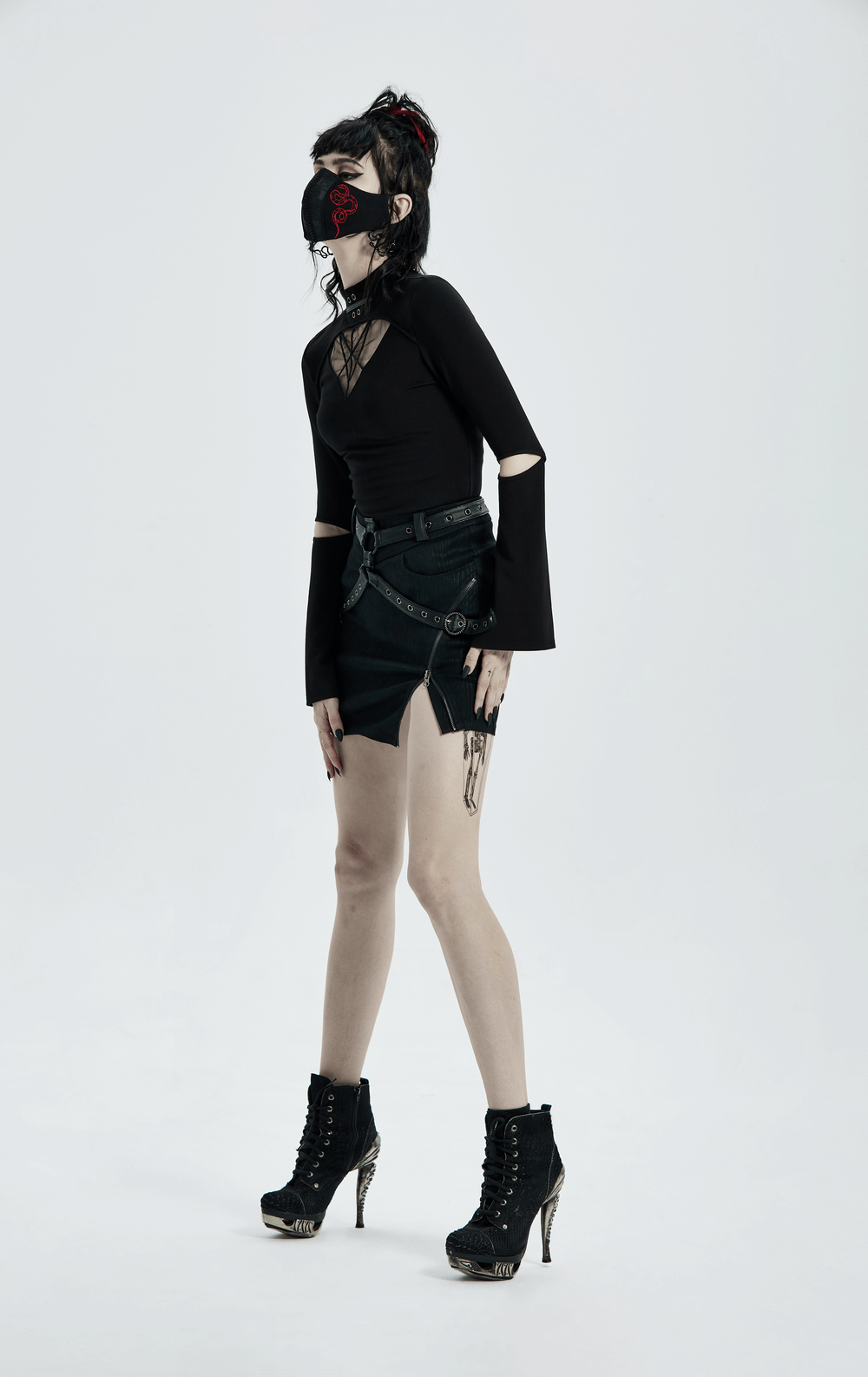 Model showcasing Striped Woven Punk Half Skirt with Alloy Ring, paired with a black top and edgy accessories.