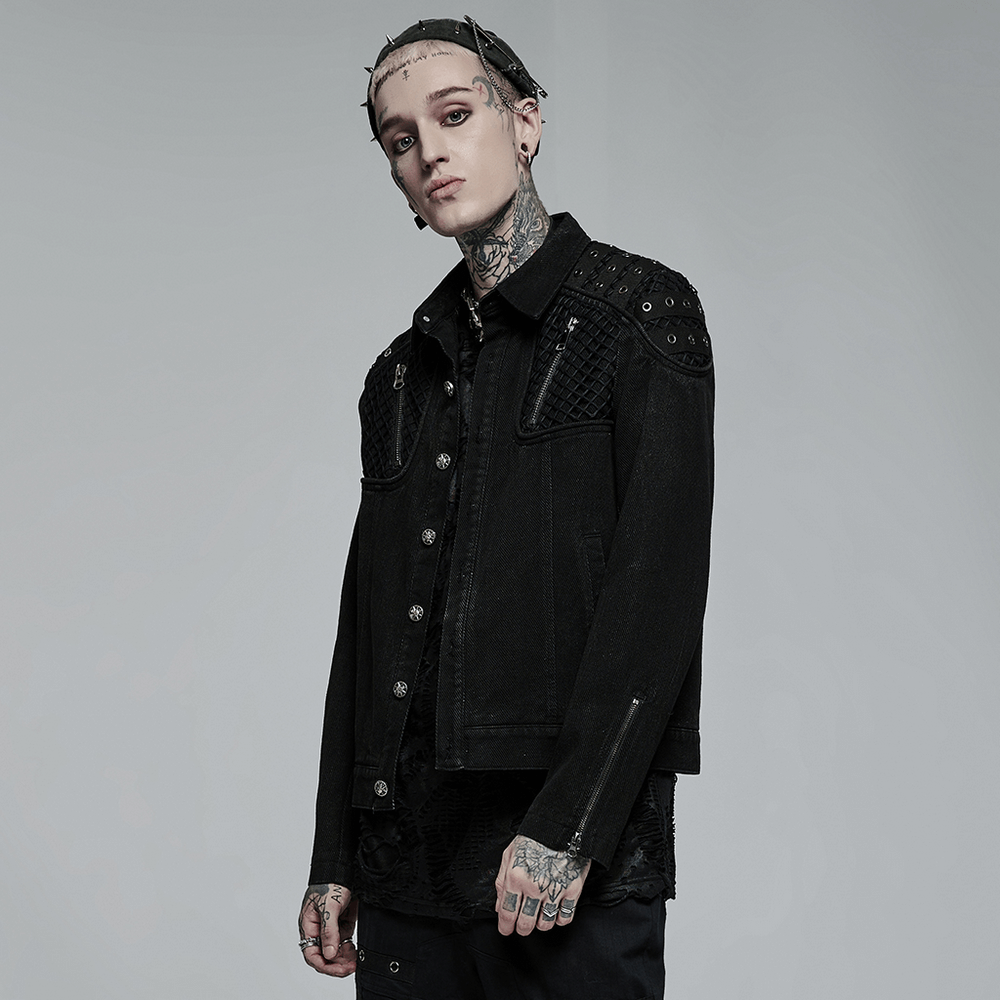 Studded black denim jacket for a punk rugged look, featuring mesh splices and a slim fit design for a stylish silhouette.