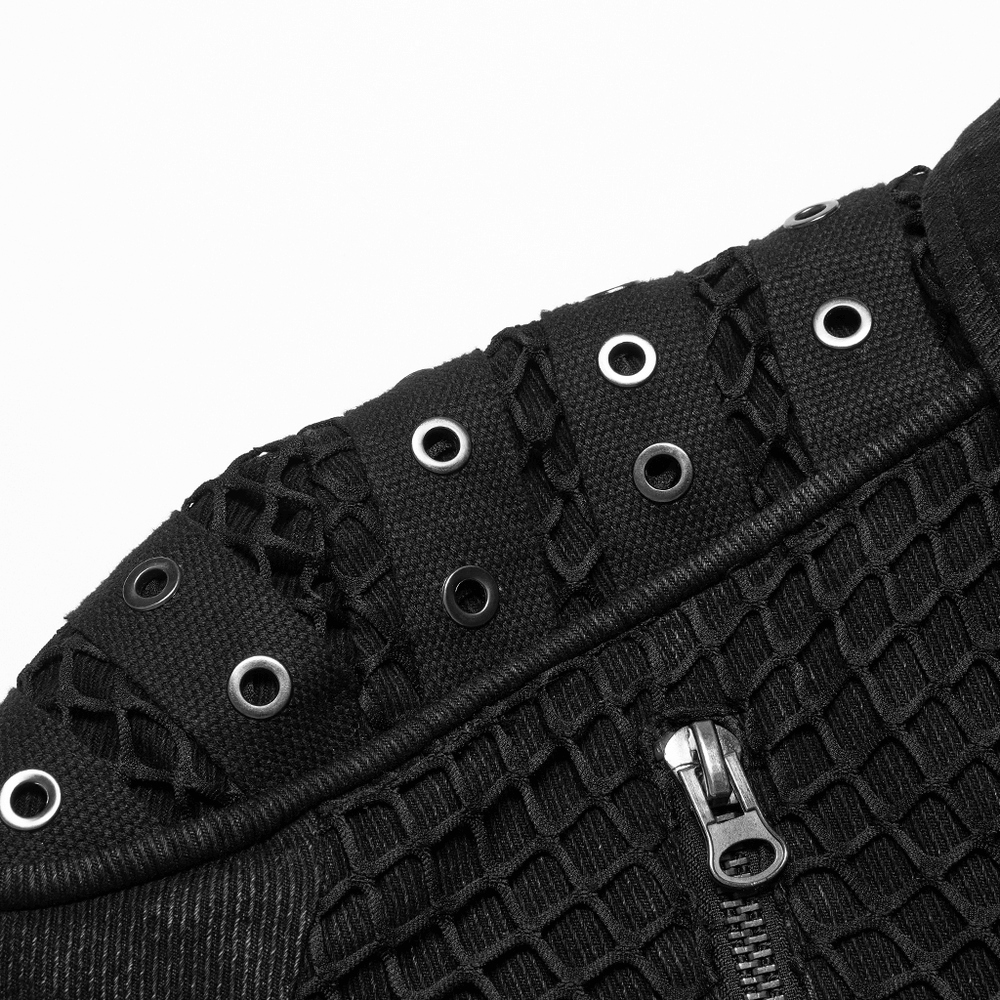 Close-up of the studded shoulder detailing on a black denim jacket, showcasing urban gothic style and punk fashion.