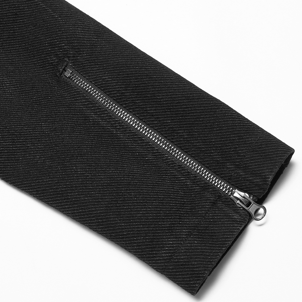 Close-up of the zipper detail on a studded black denim jacket showcasing urban gothic style.