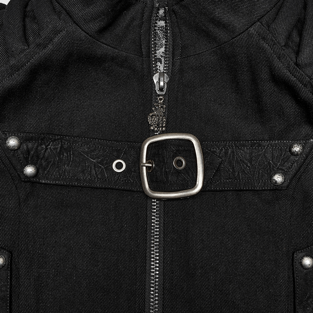 Close-up of a black studded punk vest featuring a buckle and zipper, showcasing urban gothic style.