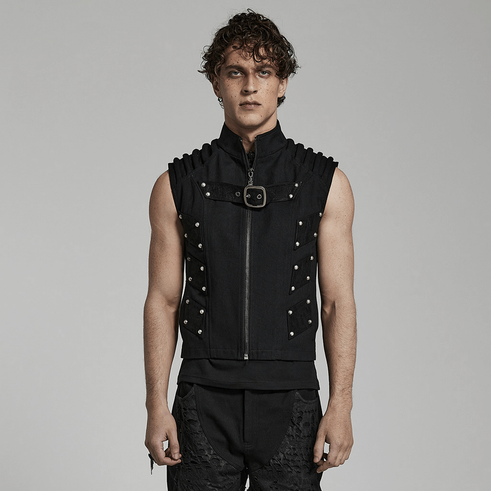 Studded Black Punk Vest on model, showcasing edgy urban gothic style with padded shoulders and rivet detailing.