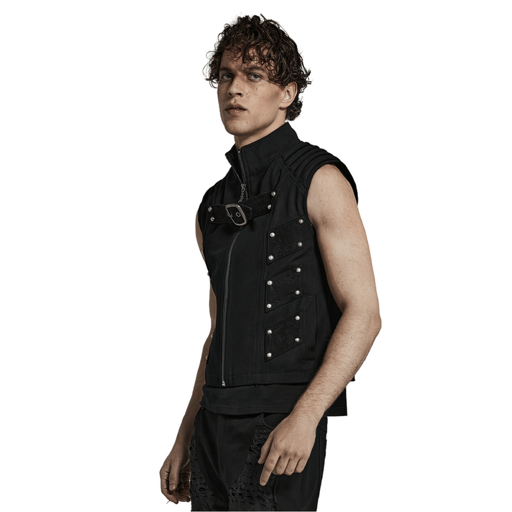 Edgy studded black punk vest showcasing street style with geometric patches and structured silhouette.