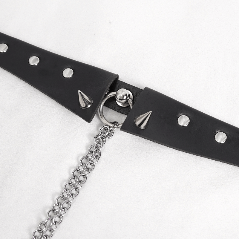 Close-up of a studded black choker with a silver chain, showcasing its punk-inspired design and edgy details.