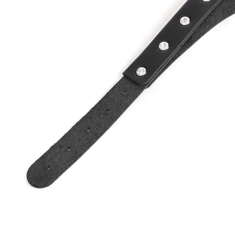 Close-up of a black studded strap showcasing punk-inspired details for edgy bodysuit accessories.