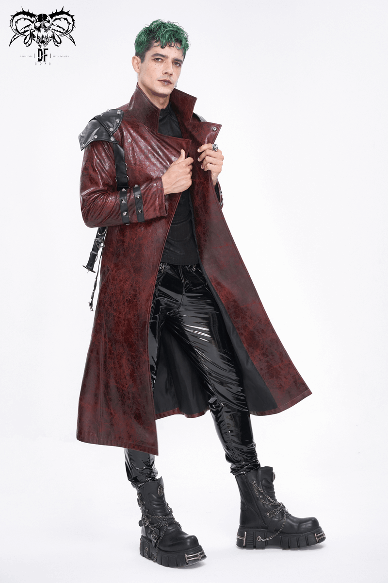 Men's edgy studded trench coat with buckles, styled with shiny black pants and boots, showcasing alternative fashion.