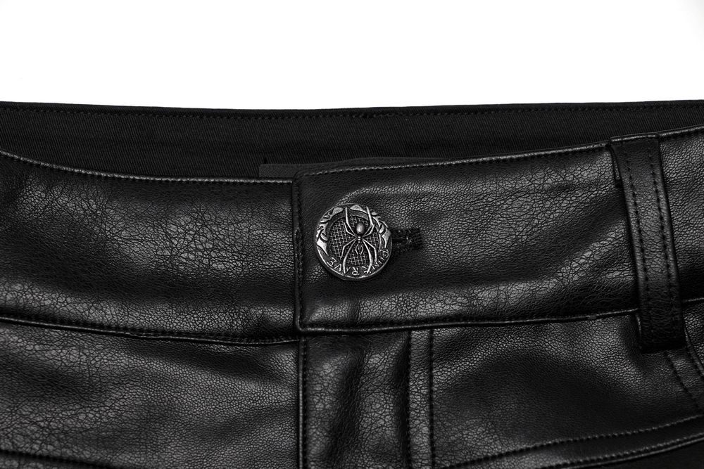 Close-up of studded button detail on edgy PU punk rocker pants, showcasing gothic style with unique texture.