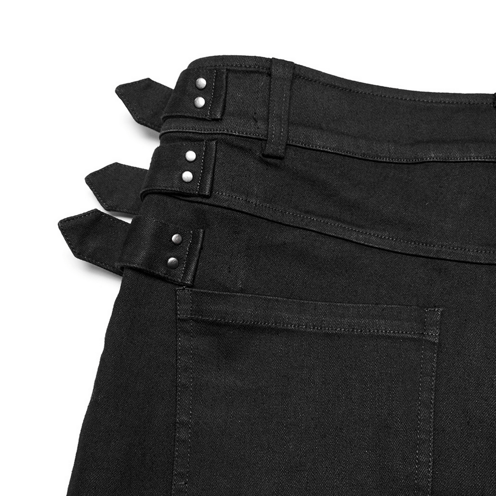 Close-up of studded waist detail on gothic PUNK slim-fit denim pants with decorative loops.