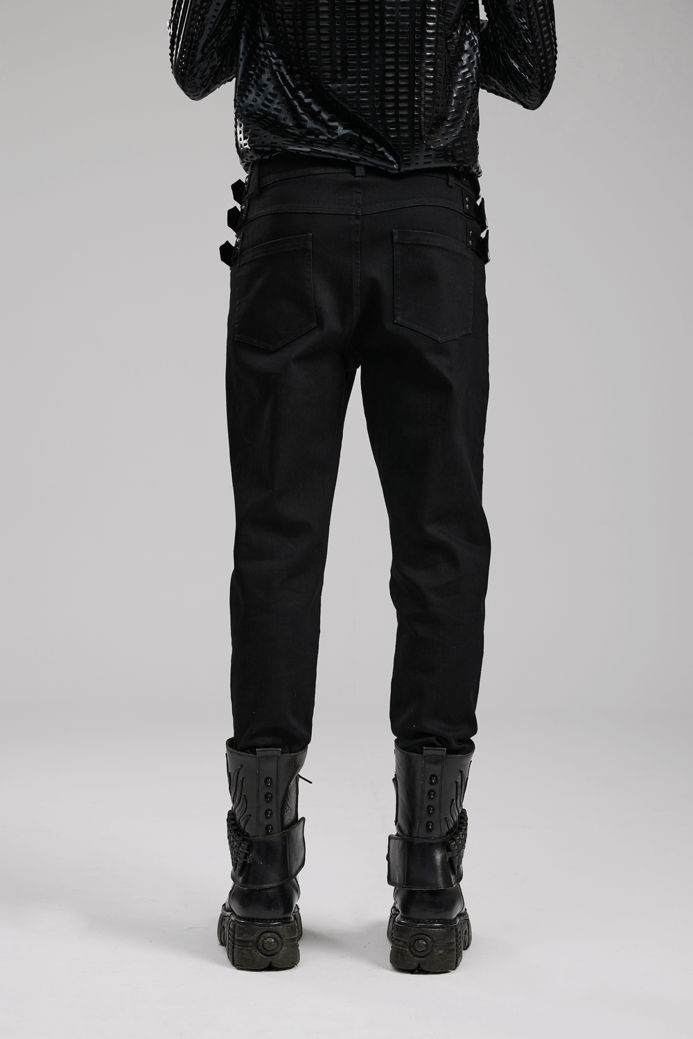 Back view of studded waist slim-fit gothic PUNK denim pants, showcasing unique loops and functional pockets.