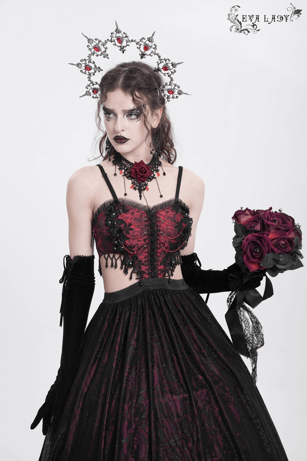 Elegant Gothic floral corset dress with lace, featuring a model holding roses and wearing dramatic accessories.