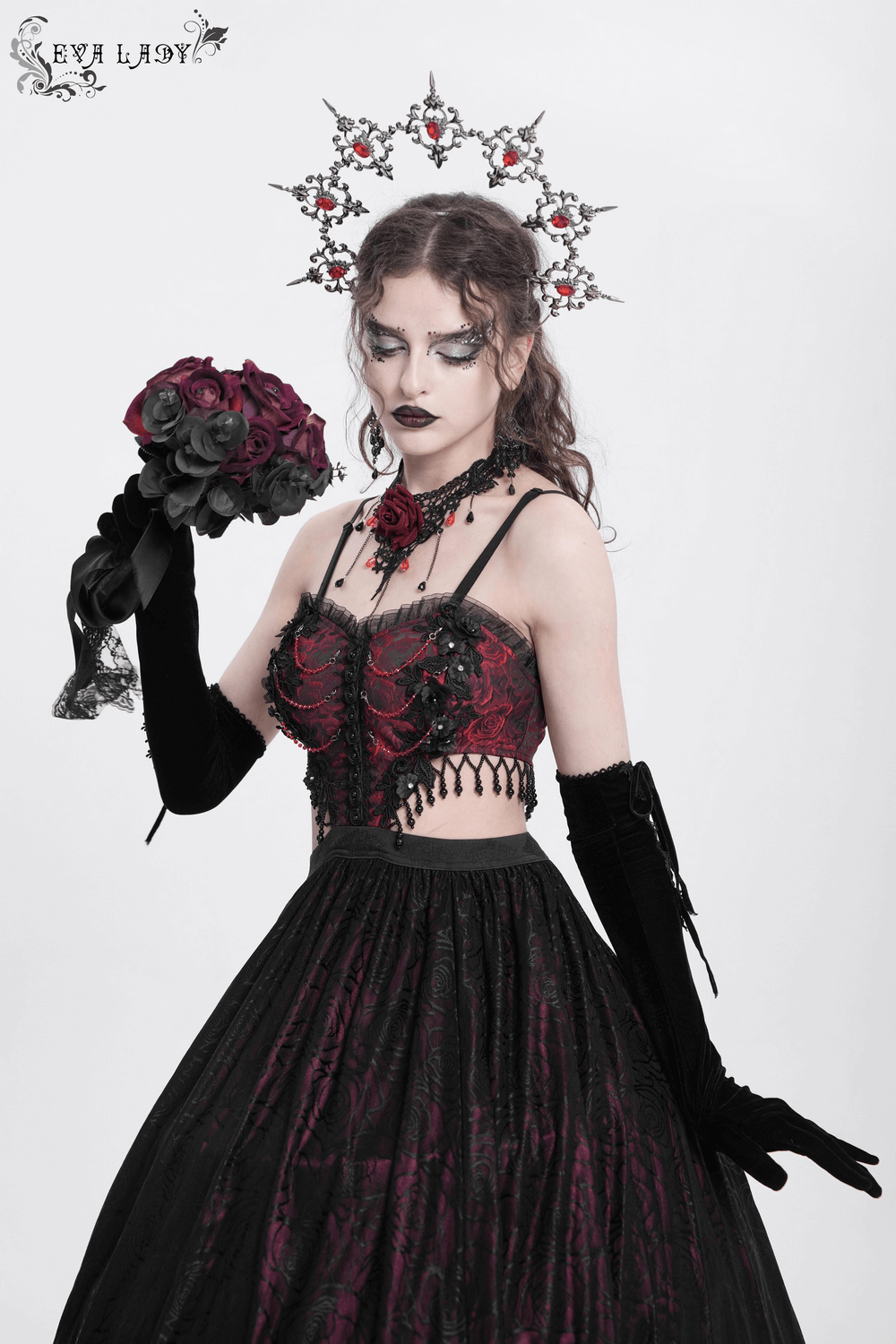 Elegant Gothic floral corset dress with lace detailing, black skirt, and rose bouquet, perfect for dark romantic style.