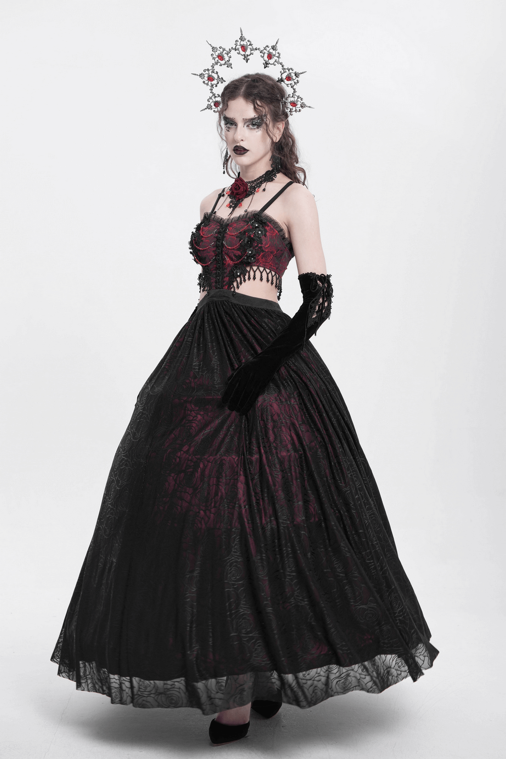Model wearing a stunning Gothic floral corset dress with lace detailing and a dramatic black skirt.