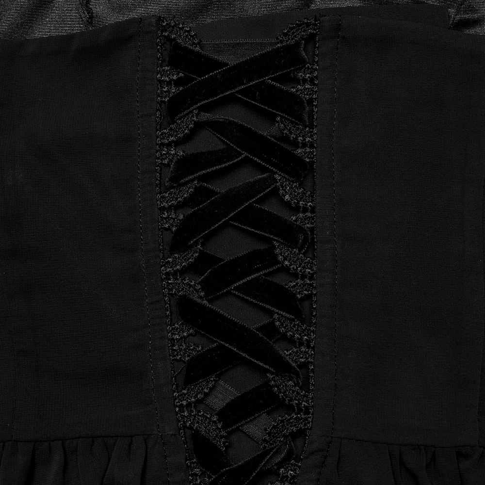 Close-up of a stunning black chiffon dress featuring elegant lace-up detailing.