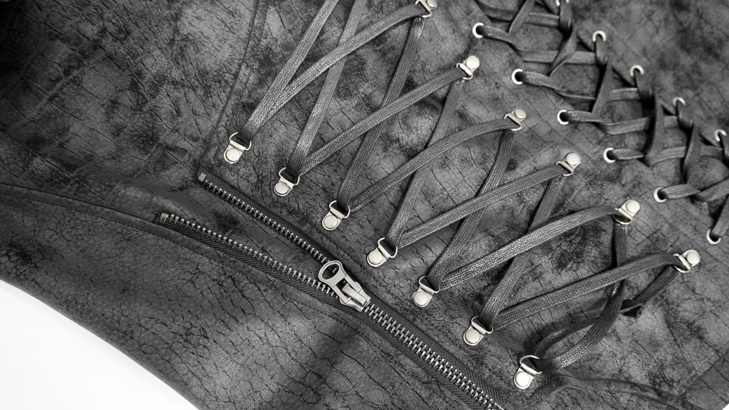 Close-up of stylish asymmetric men's black PU leather vest with lacings and zipper details.