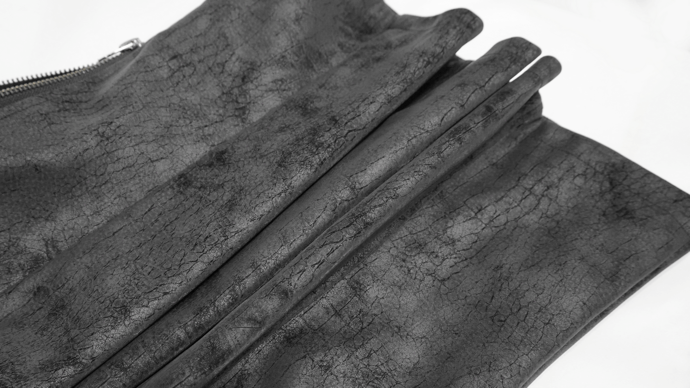 Close-up of textured black PU leather fabric for a stylish asymmetric men's vest.