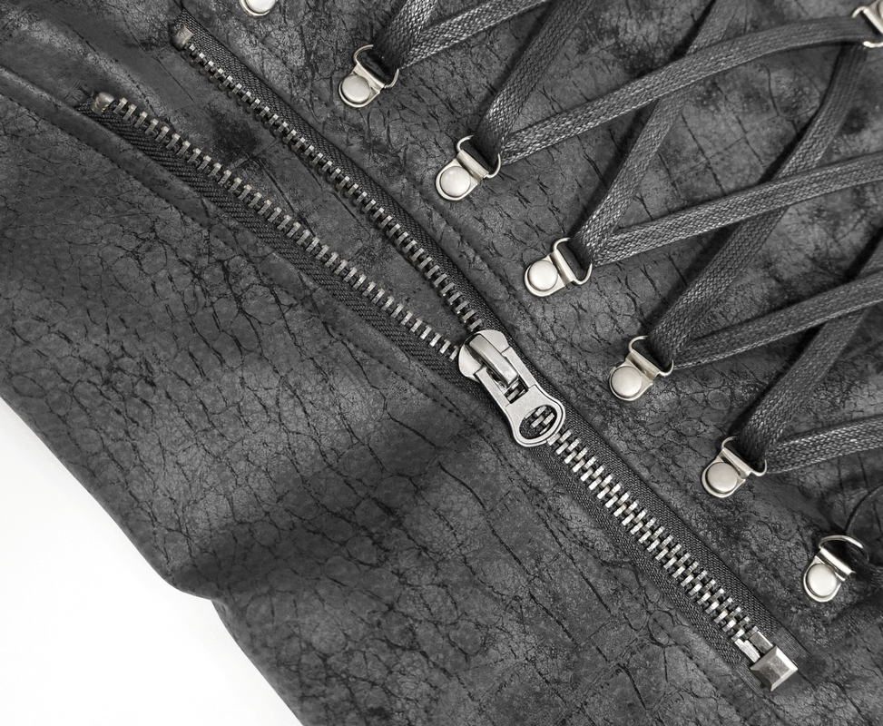 Close-up of a black PU leather vest showcasing asymmetrical lacing and a zipper detail for a gothic style.