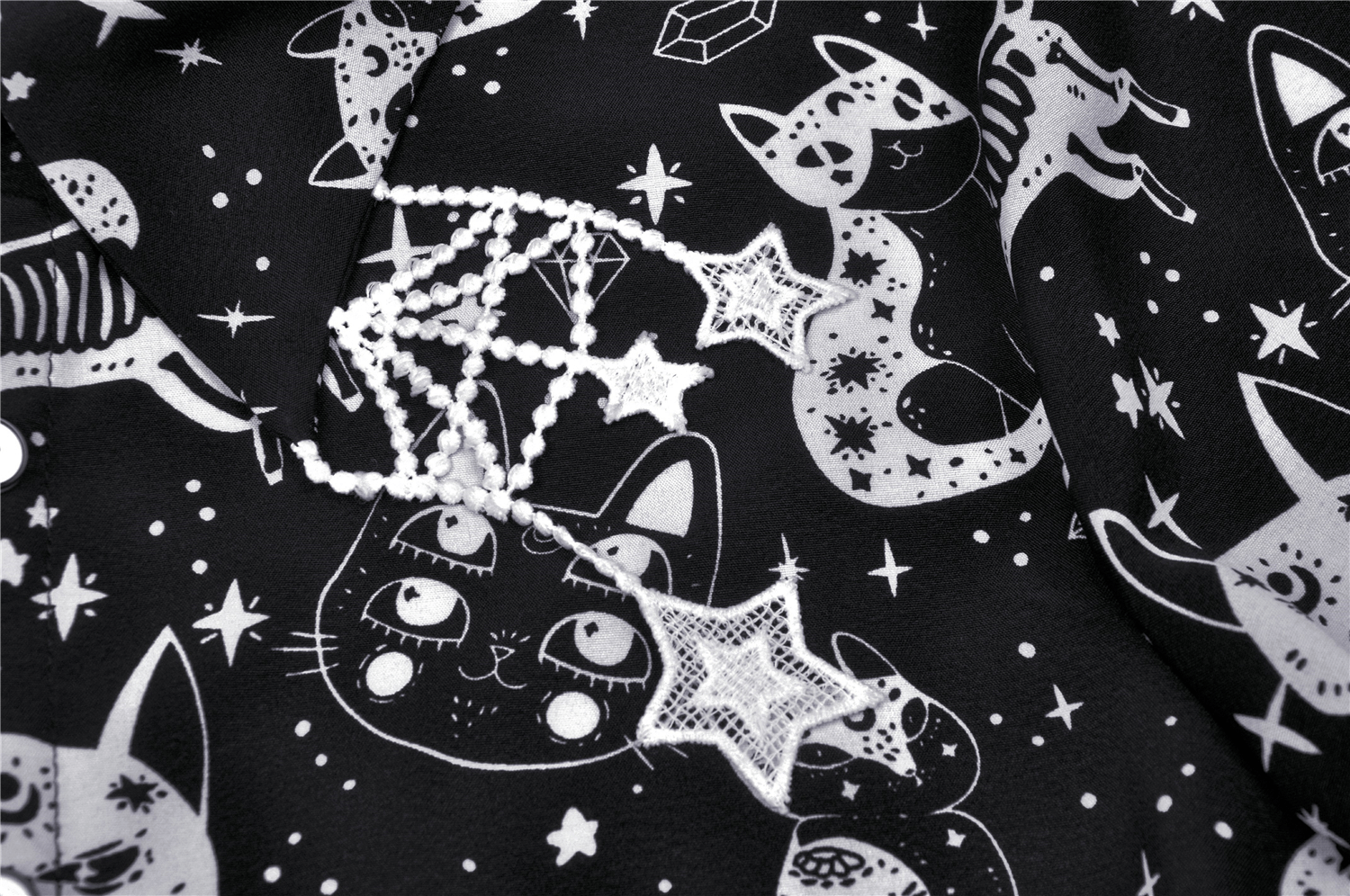 Stylish black and white cat print blouse with spooky stars for gothic punk fashion.