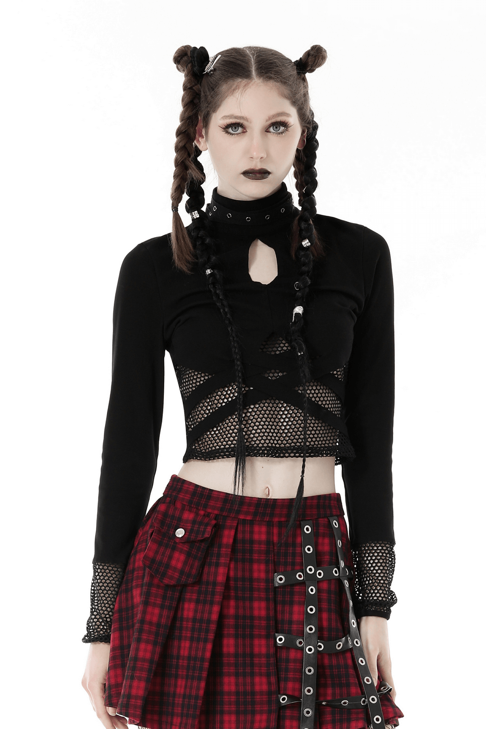Stylish black crop top with edgy cut-outs, mesh sleeves, and a plaid skirt, perfect for a punk-inspired look.