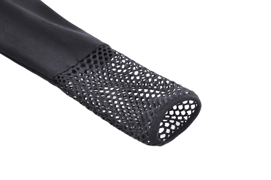 Close-up of black crop top sleeve featuring edgy mesh design for a punk-inspired style.