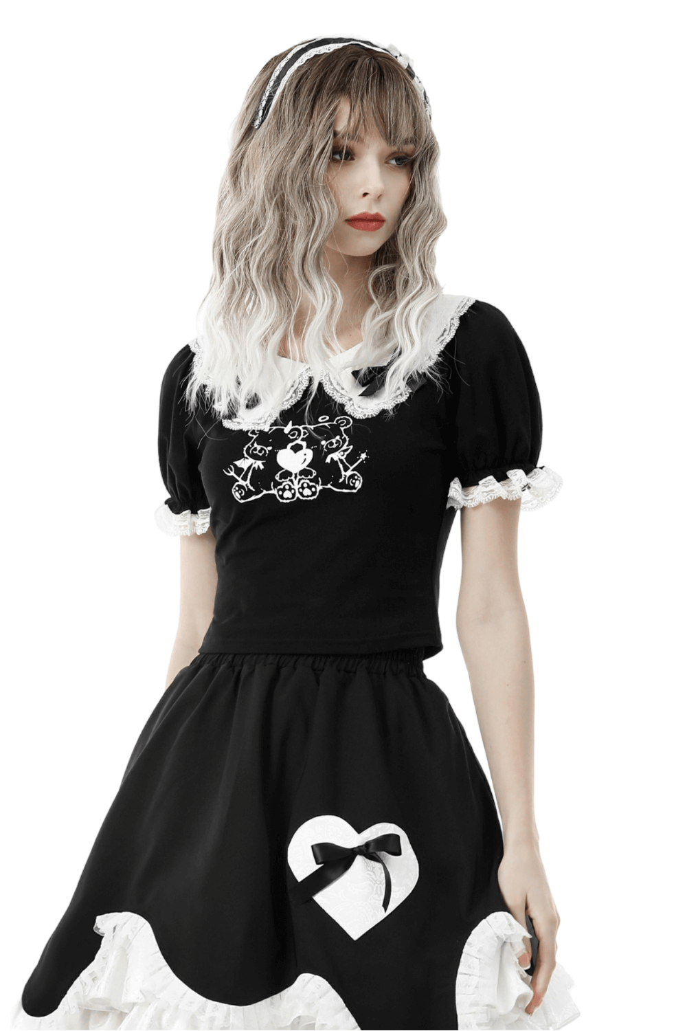 Model wearing a stylish black crop top with lace collar and puff sleeves, paired with a matching skirt.