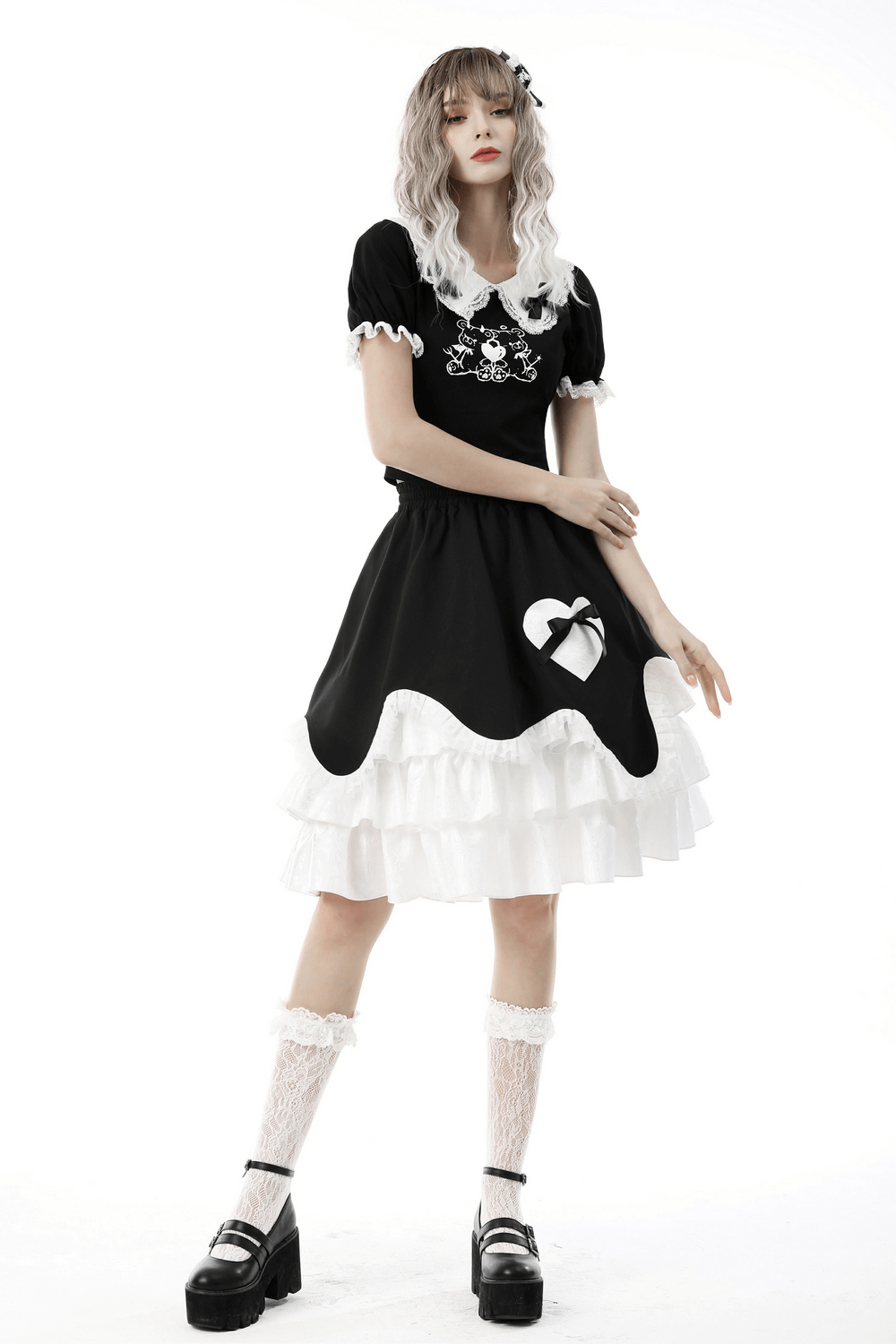 Gothic-style black dress with white lace collar and heart detail, embodying a Victorian-inspired aesthetic.