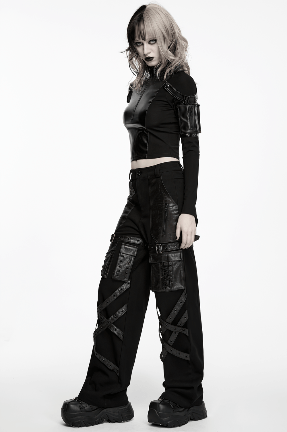 Stylish Black Cyberpunk Top with Utility Arm Pockets worn with tactical black pants, showcasing a fierce punk look.