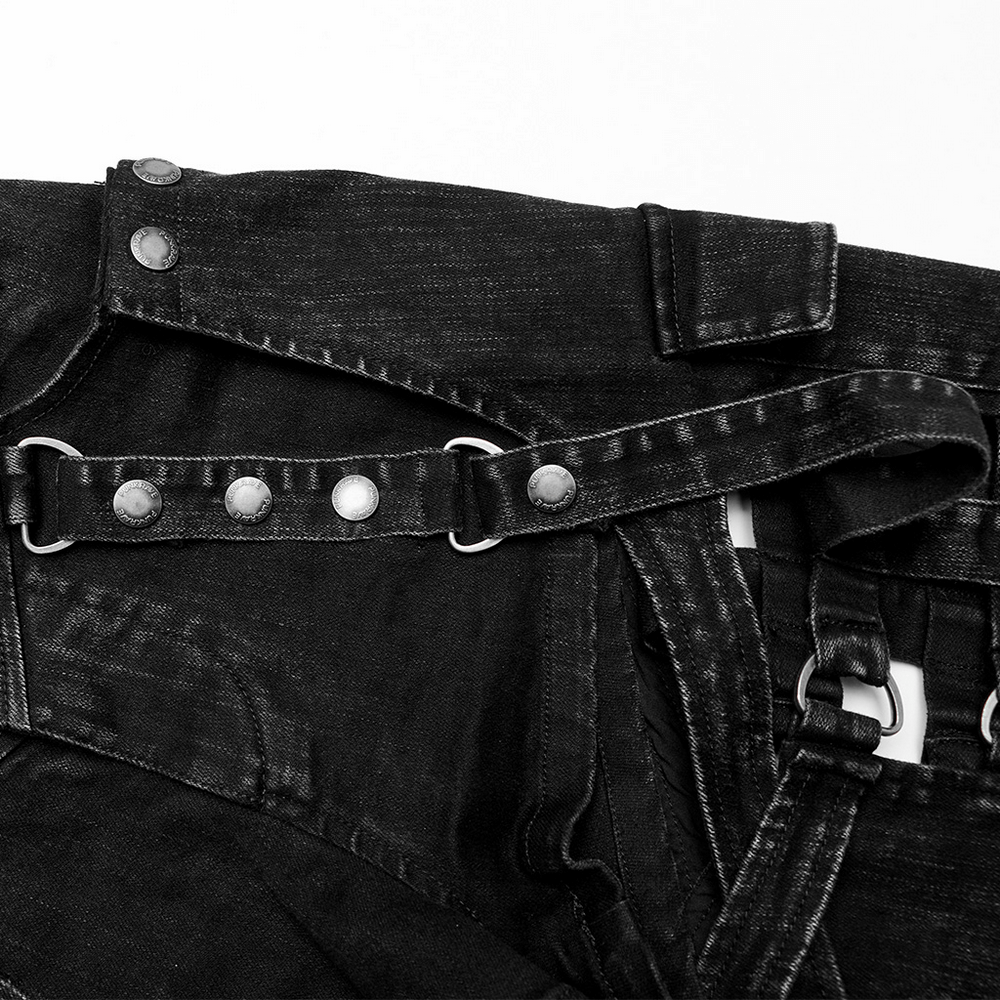 Close-up of stylish black denim shorts with unique hollow-out design and detachable features for a punk look.