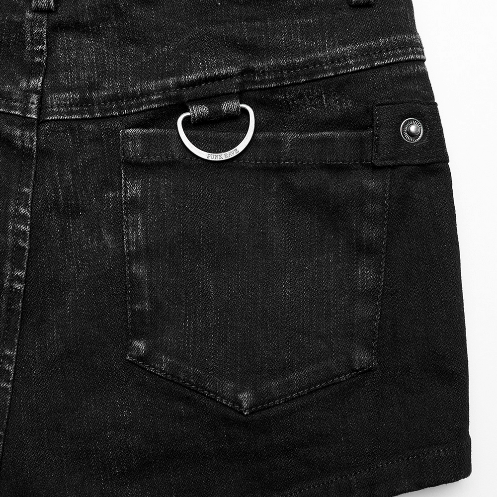Close-up of stylish black denim shorts with a unique ring detail, perfect for a punk-inspired outfit.