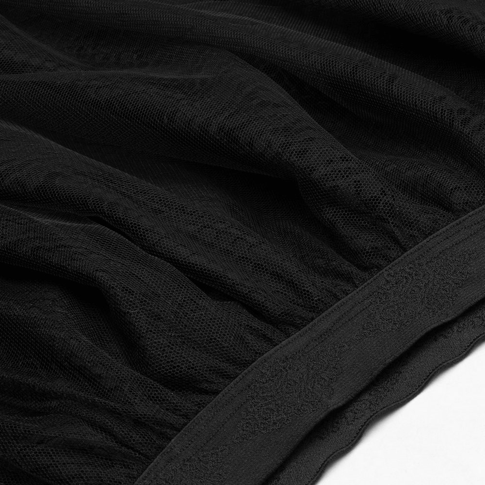 Close-up of soft black mesh fabric showcasing intricate texture and elastic waistband detail for gothic skirt