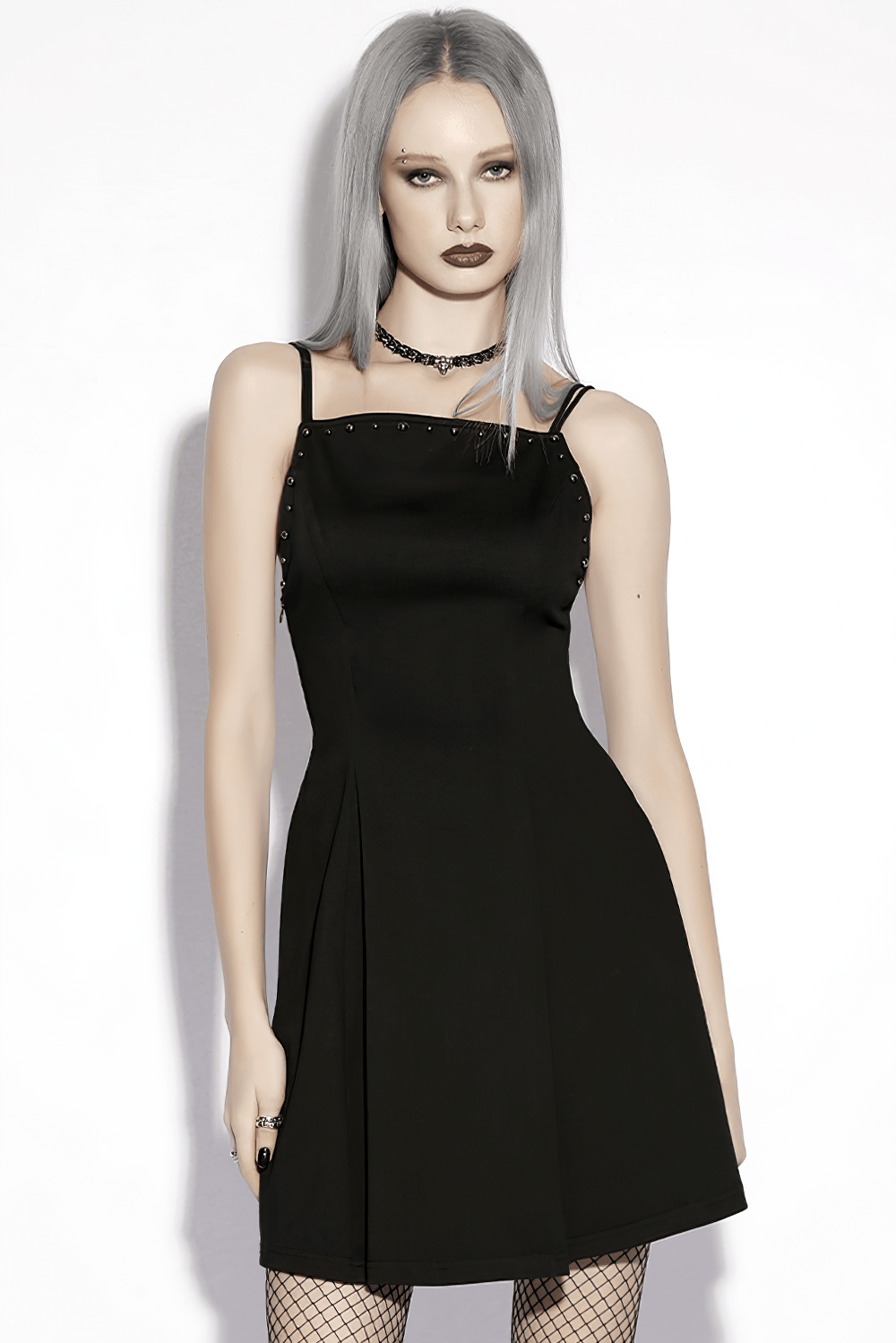 Alt Tag: Stylish Black Gothic Studded Strappy A-Line Mini Dress with square neck, slim straps, and metal studs on model