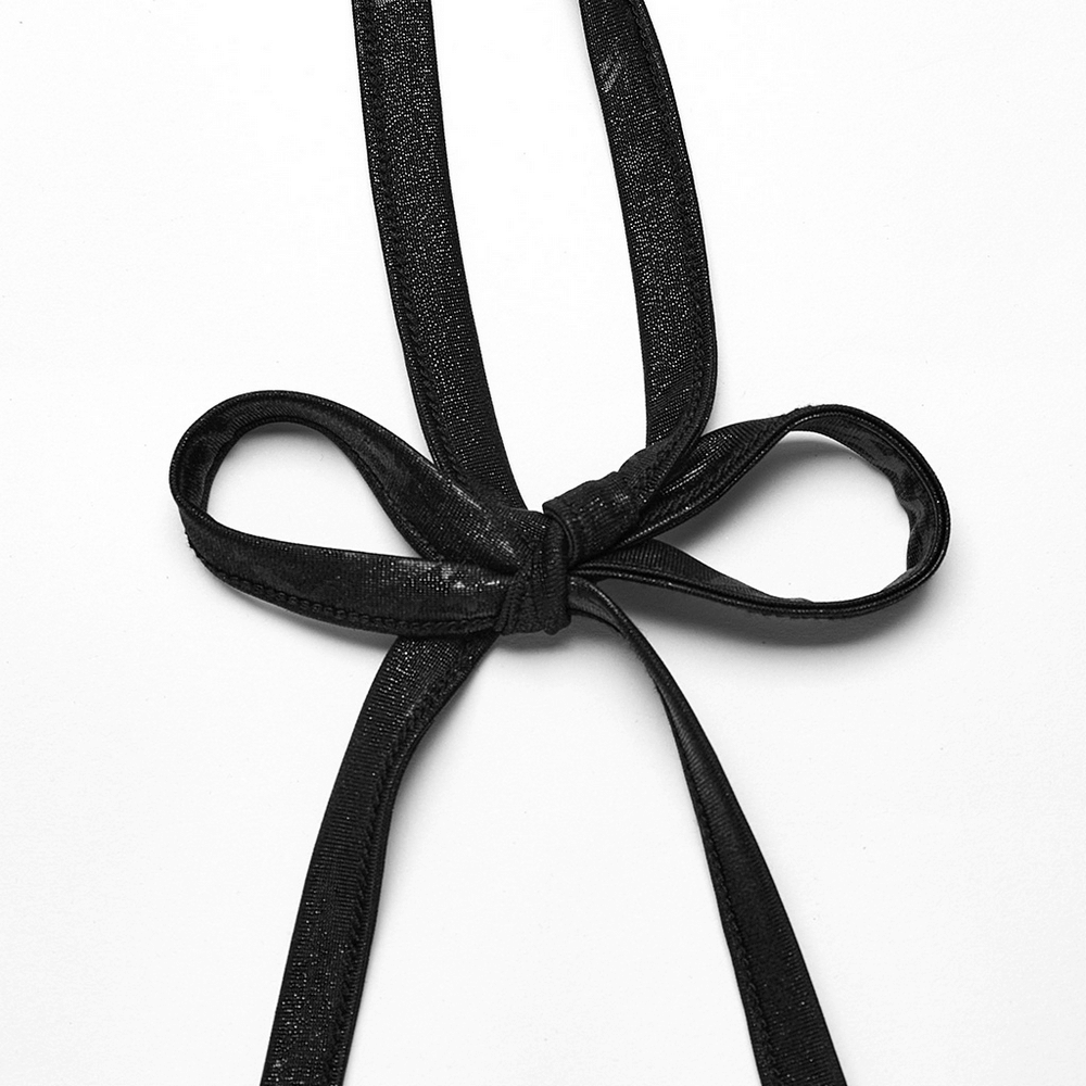 Close-up of a stylish black halter neck bow tie, showcasing the textured fabric for a chic punk rock look.