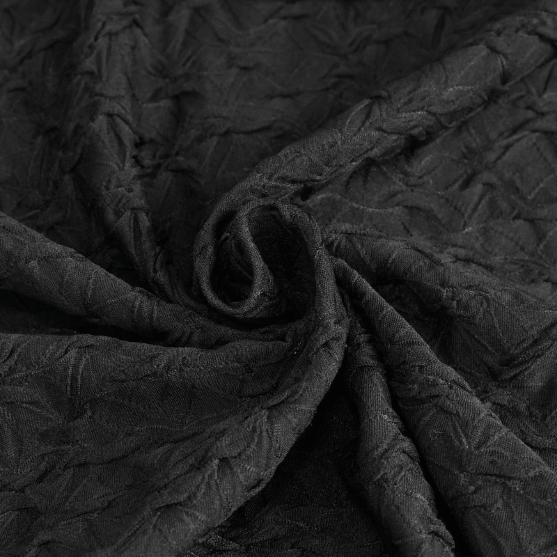 Textured black fabric showcasing a stylish crinkled pattern, perfect for edgy fashion designs.