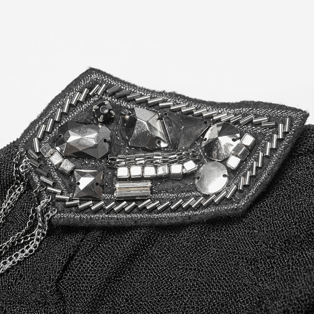 Close-up of embellished black lace halter top showcasing intricate bead and chain details for a chic punk look.