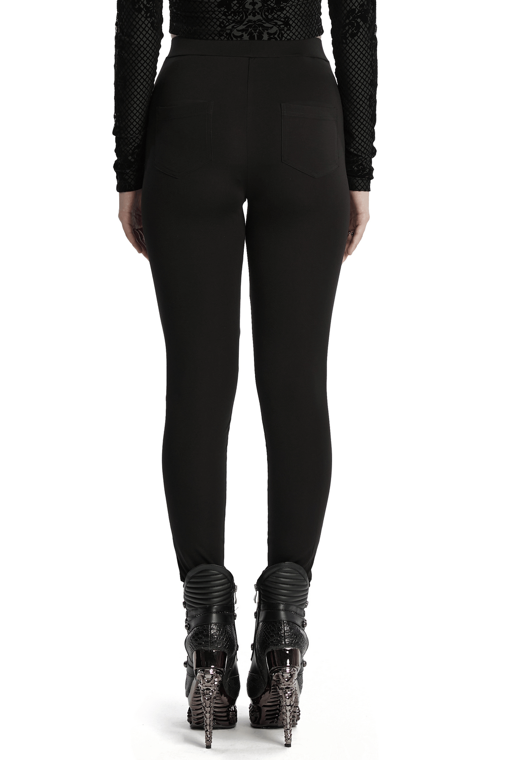 Back view of stylish black leggings with mesh side panels and chic detailing, paired with bold fashion heels.
