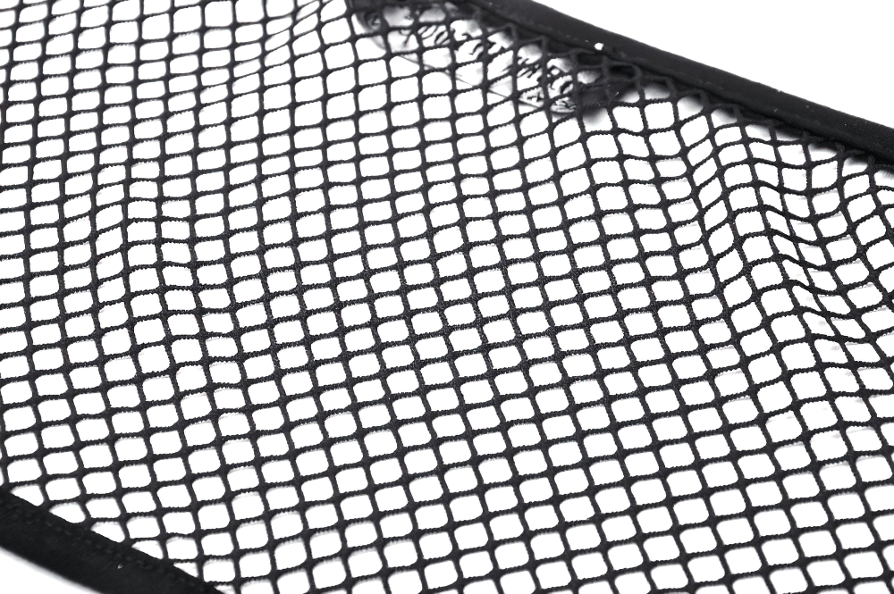 Close-up of stylish black fishnet fabric, perfect for bold fashion statements and edgy outfit layering.