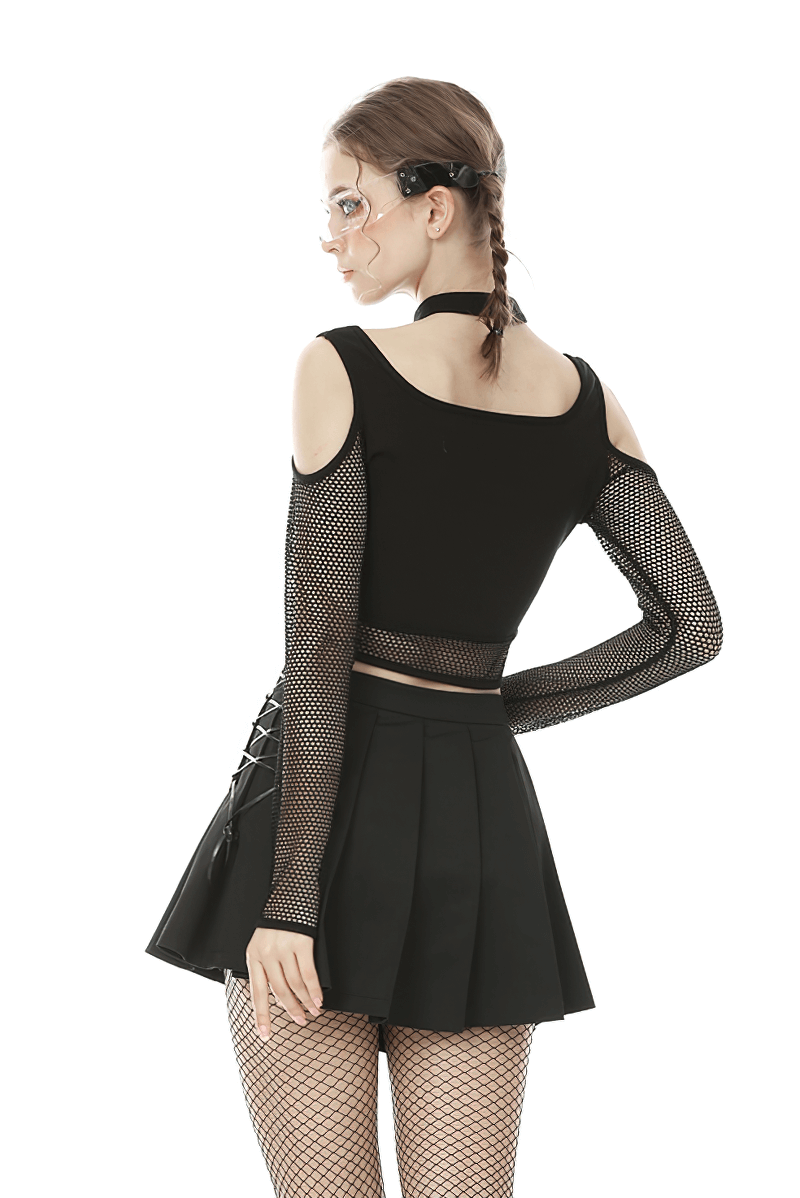 Chic black mesh crop top with cold shoulder design and fishnet sleeves, paired with a stylish black pleated skirt.