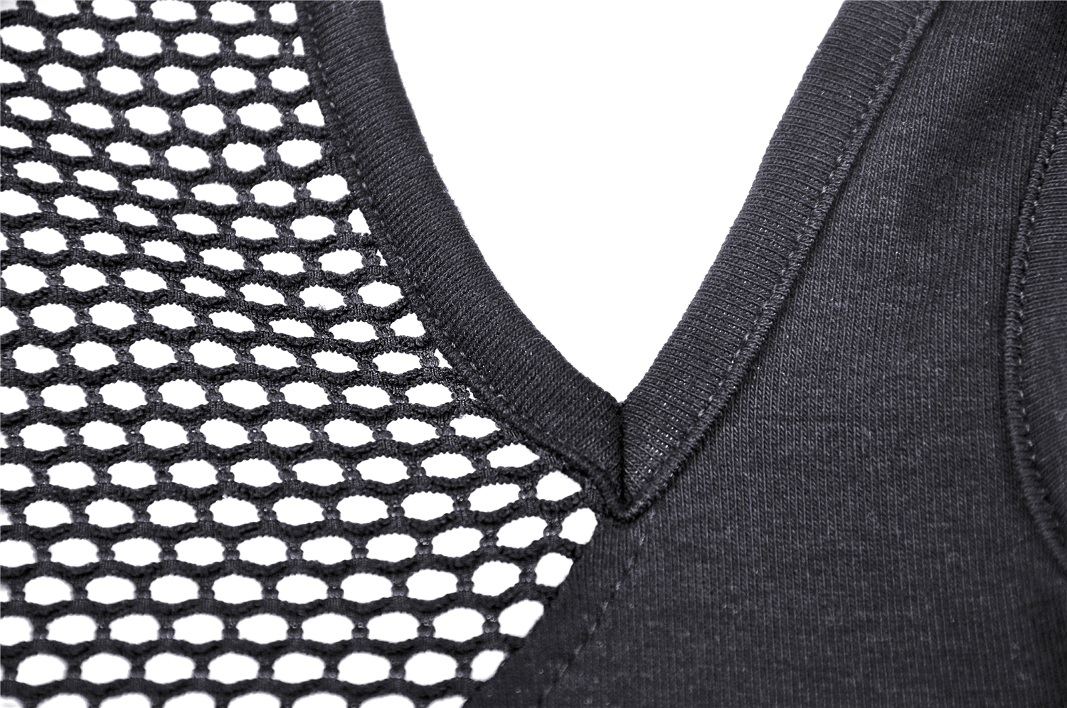 Close-up of stylish black mesh crop top with fishnet sleeve detailing and v-neck design.